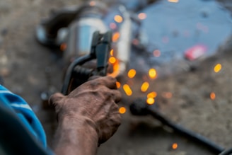 A man holding a gun in his right hand