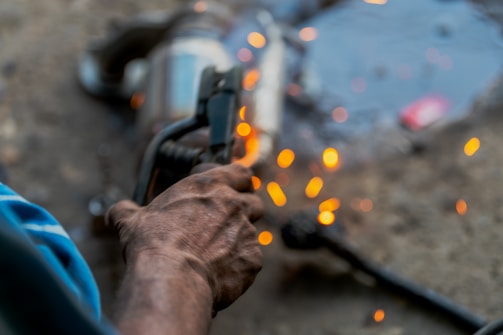 A man holding a gun in his right hand