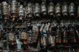 A bunch of metal objects hanging on a wall