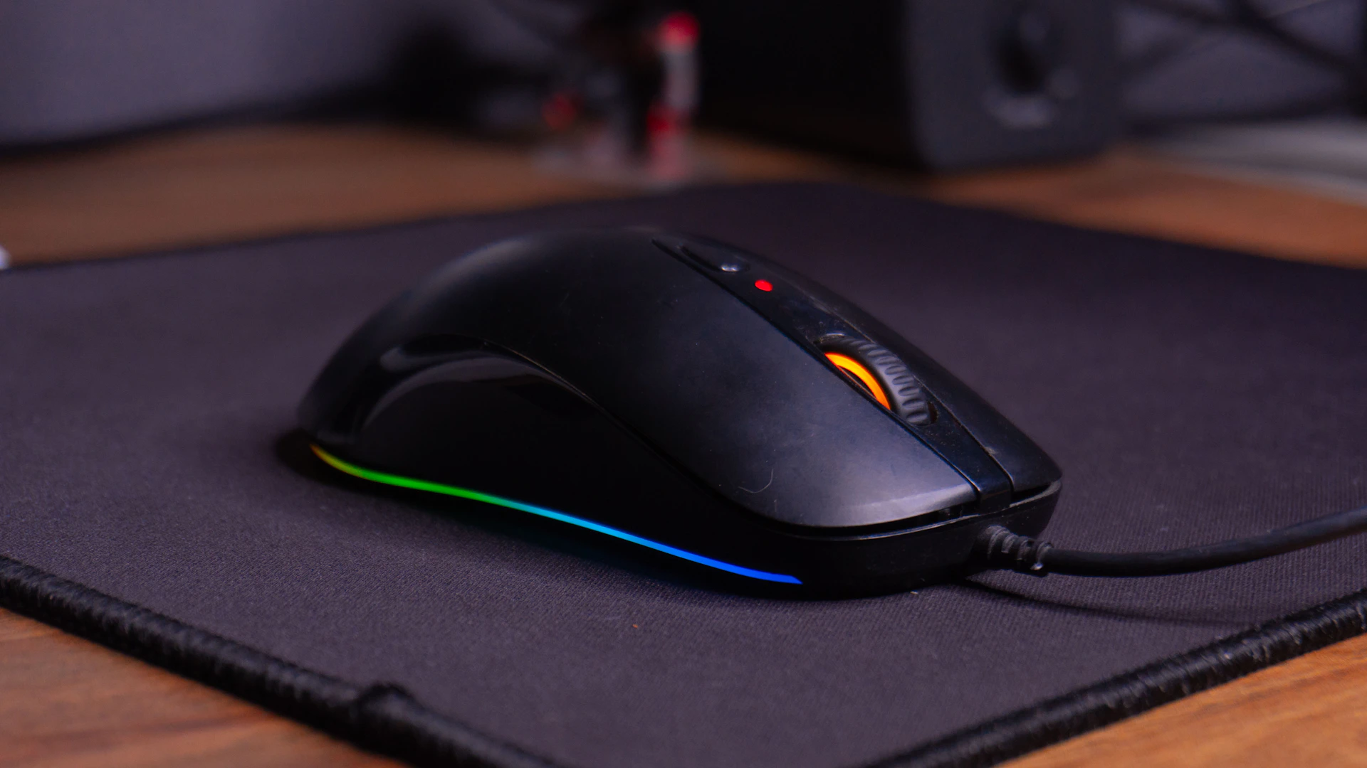 A computer mouse sitting on top of a mouse pad