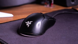 A computer mouse sitting on top of a mouse pad