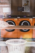 A row of washing machines in a store window