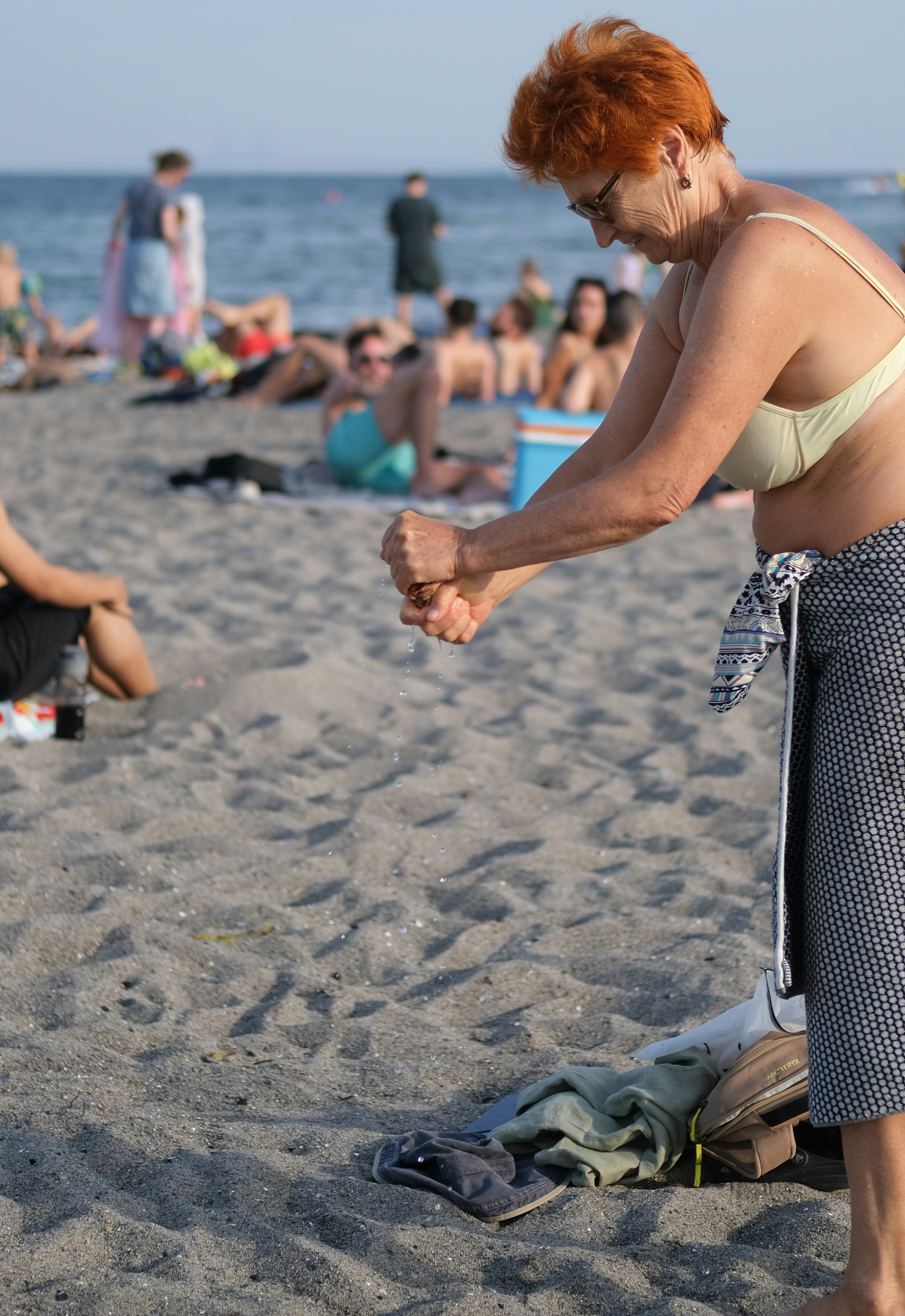 A woman in a bathing suit on a beach