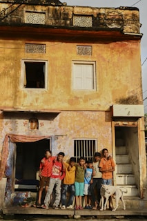 A group of people standing in front of a building