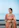 A woman in a sari posing for a picture