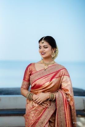 A woman in a sari posing for a picture