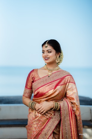 A woman in a sari posing for a picture