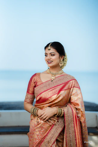 A woman in a sari posing for a picture