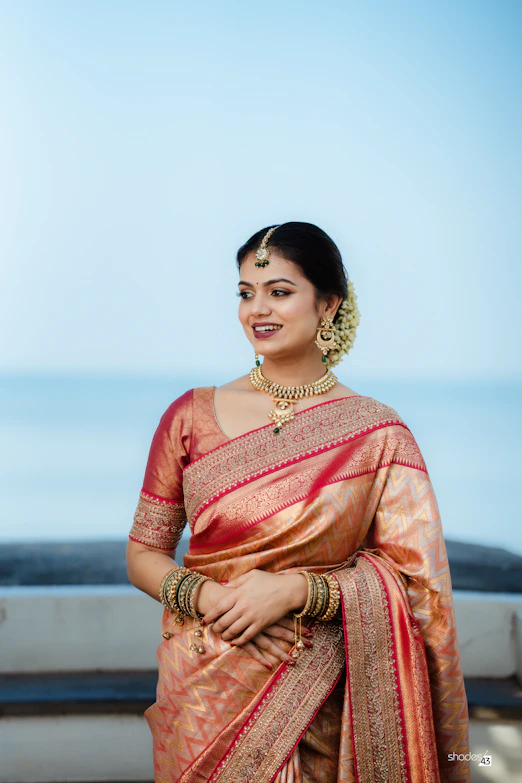A woman in a sari posing for a picture