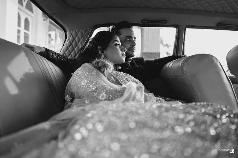 Sugar daddy and sugar baby sharing a ride in a luxury car