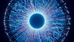 A close up of a blue eyeball in the dark