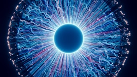 A close up of a blue eyeball in the dark