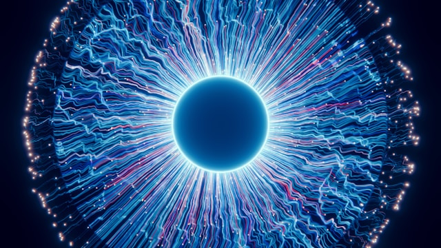 A close up of a blue eyeball in the dark