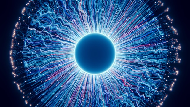 A close up of a blue eyeball in the dark