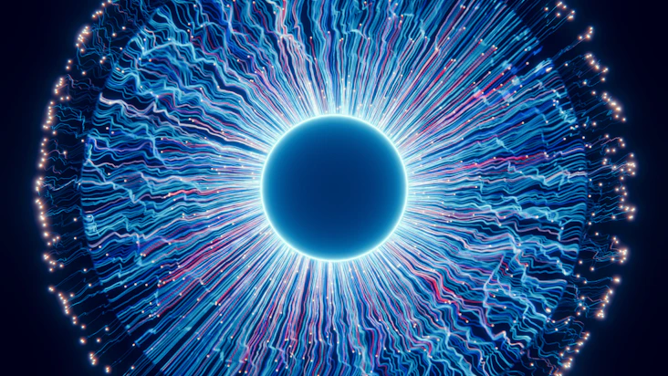 A close up of a blue eyeball in the dark