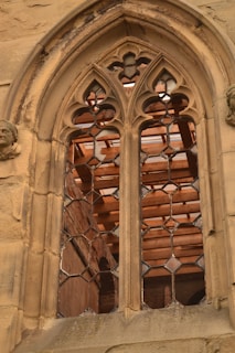 A window in a stone building with a window pane