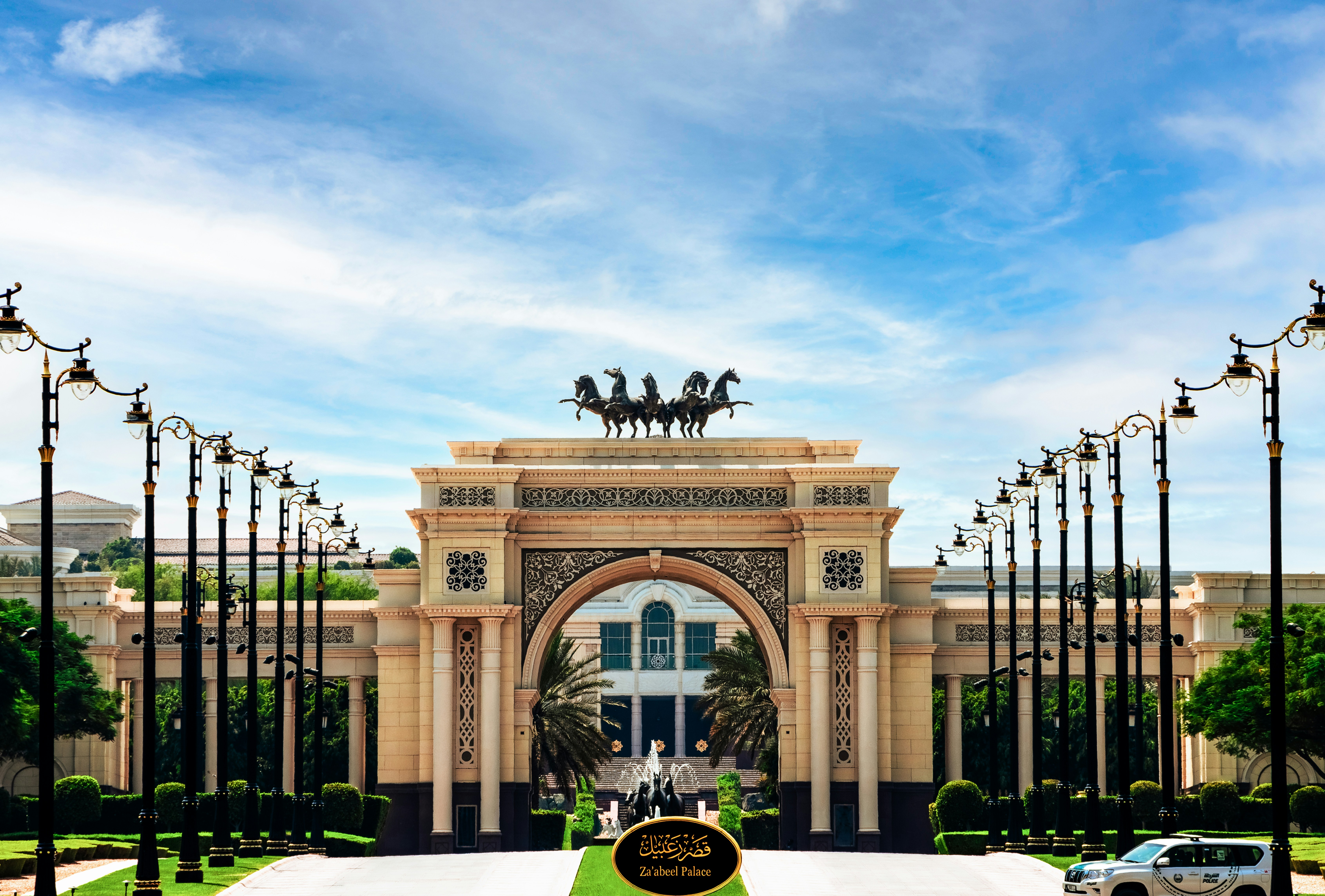 A large building with a statue of a horse and carriage in front of it