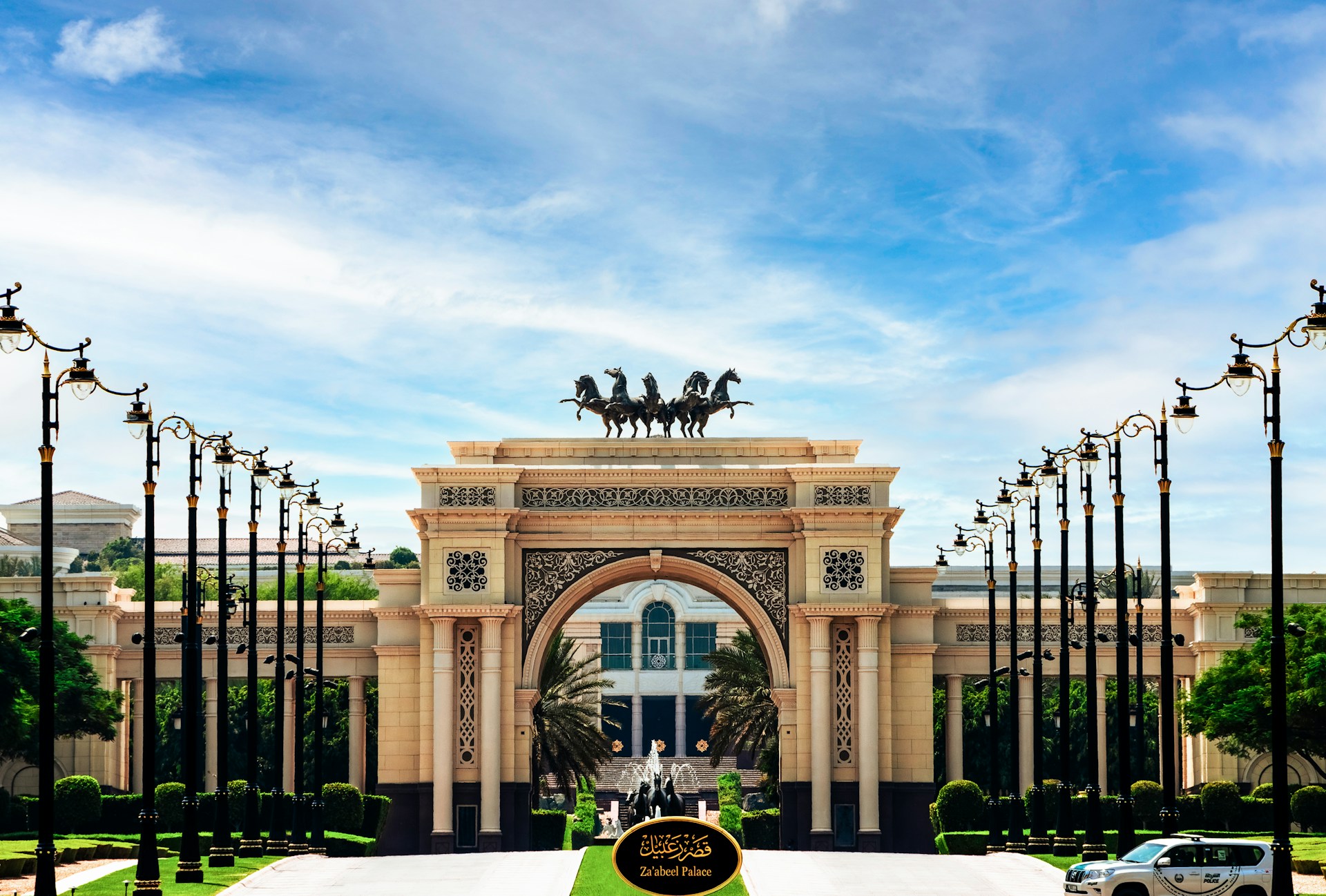 A large building with a statue of a horse and carriage in front of it