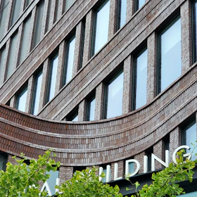 A tall building with a sign on the side of it