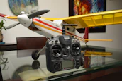 A model airplane sitting on top of a glass table