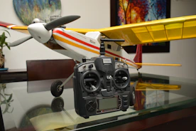 A model airplane sitting on top of a glass table