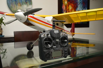 A model airplane sitting on top of a glass table