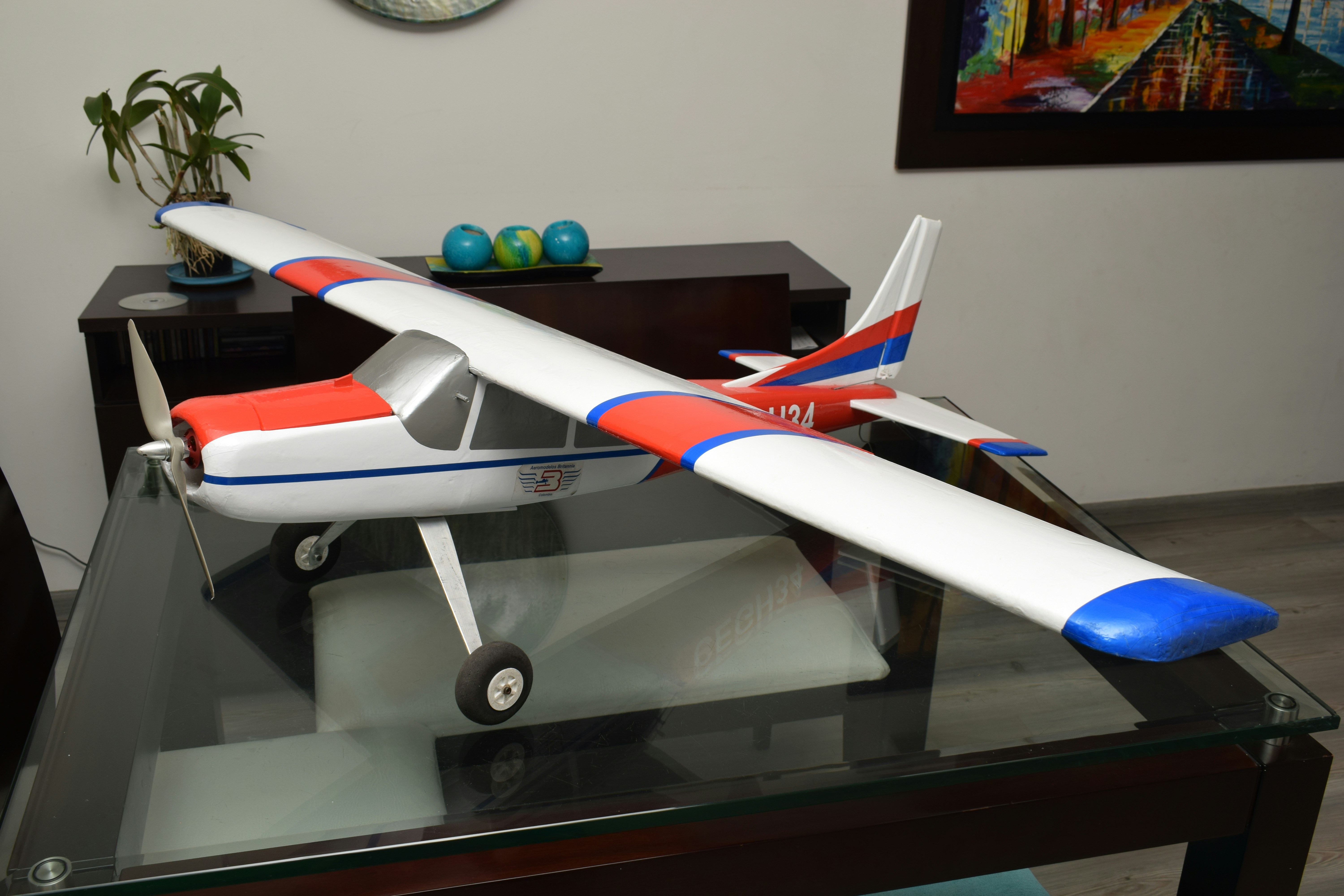A model airplane sitting on top of a glass table