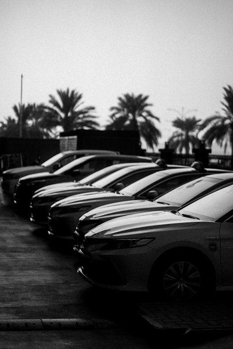 A row of parked cars in a parking lot