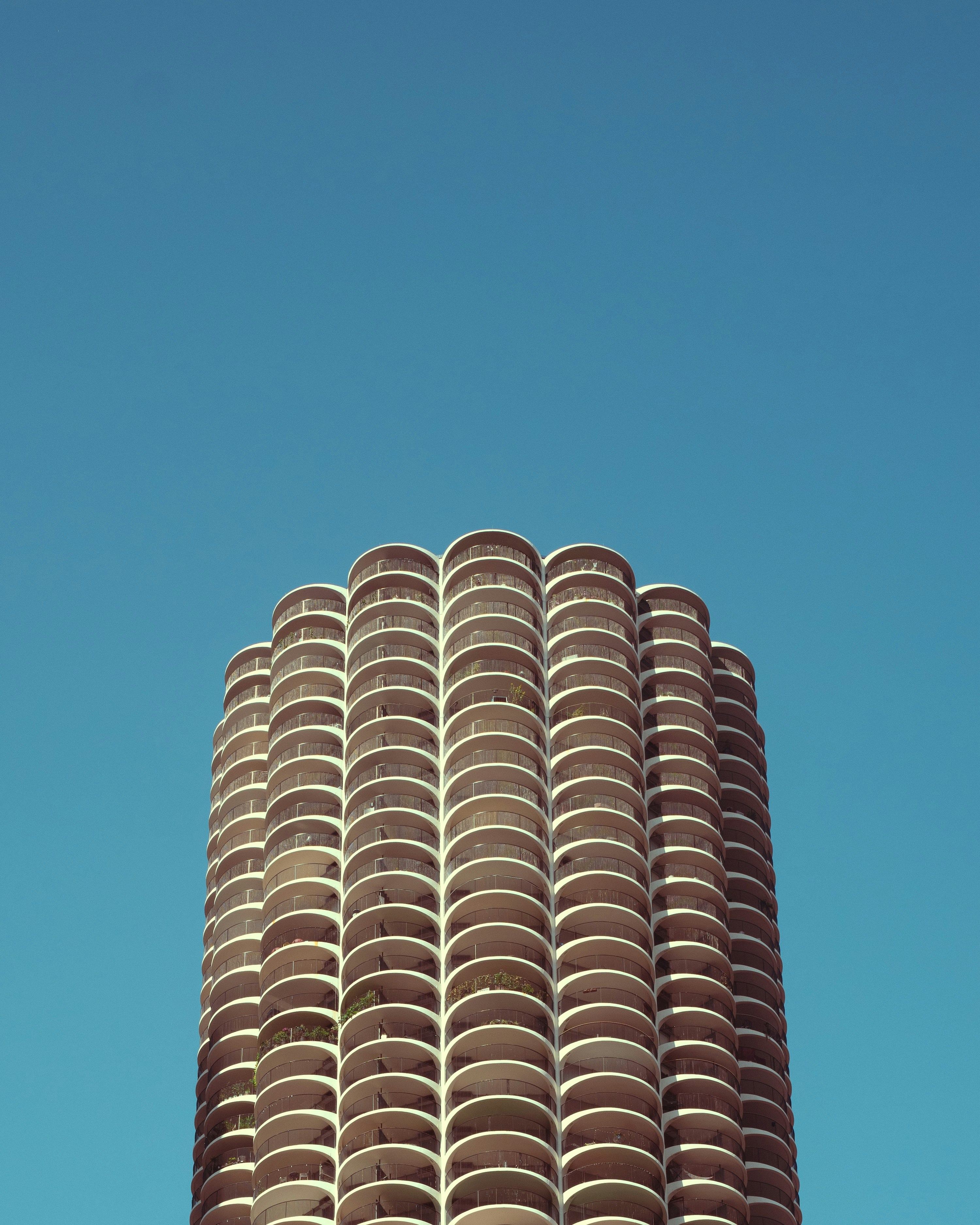 A very tall building with a clock on it's side