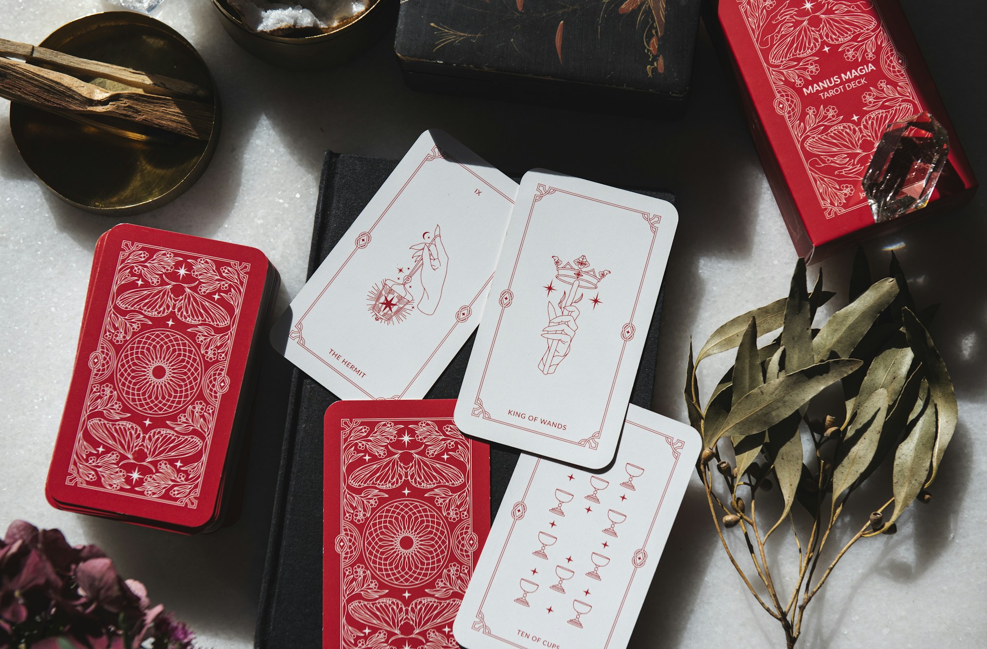 A table topped with lots of red and white playing cards