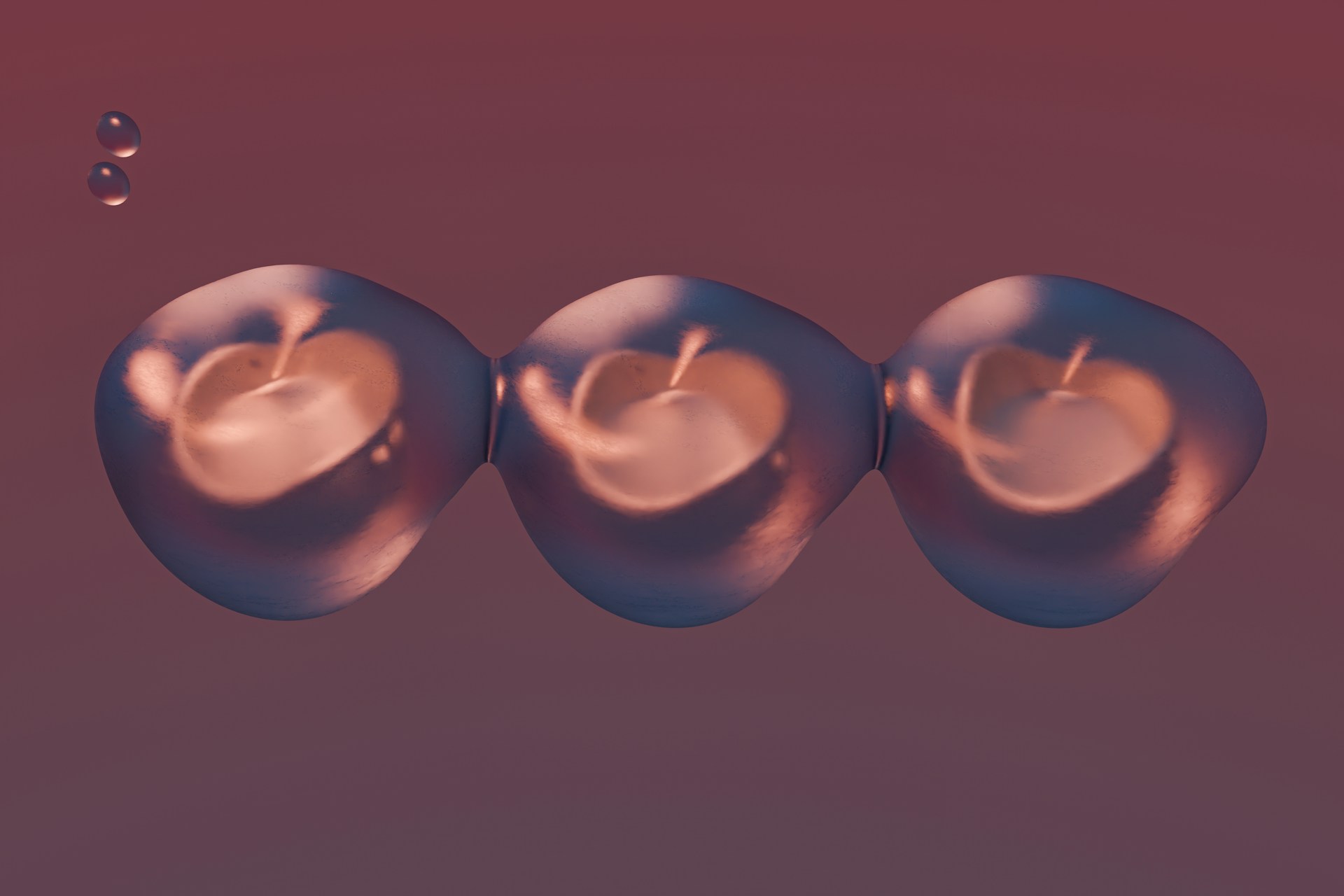 A group of three apples floating on top of each other