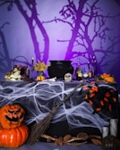 A table topped with lots of halloween decorations