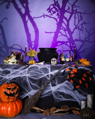 A table topped with lots of halloween decorations
