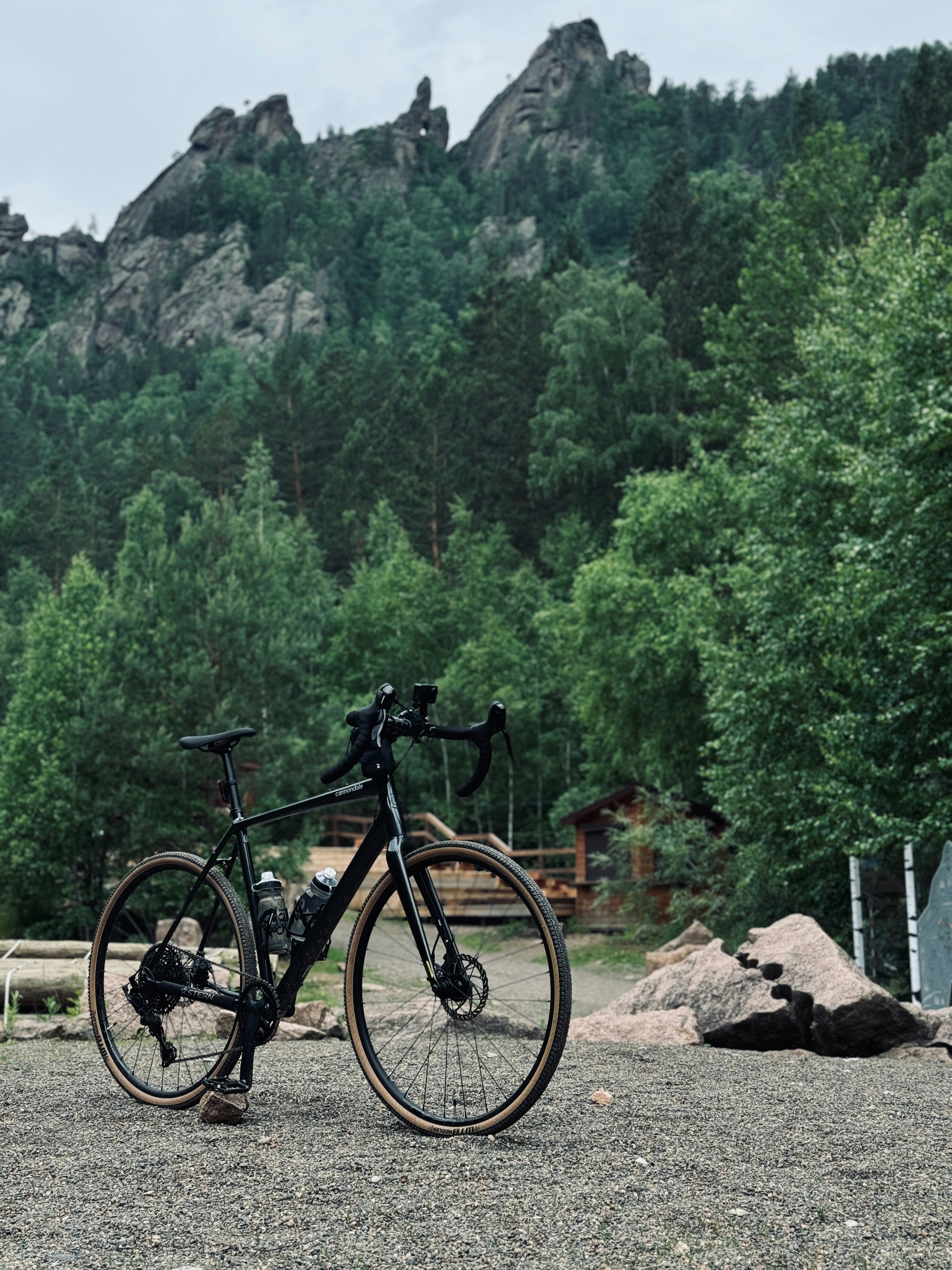 A bicycle is parked in front of a mountain