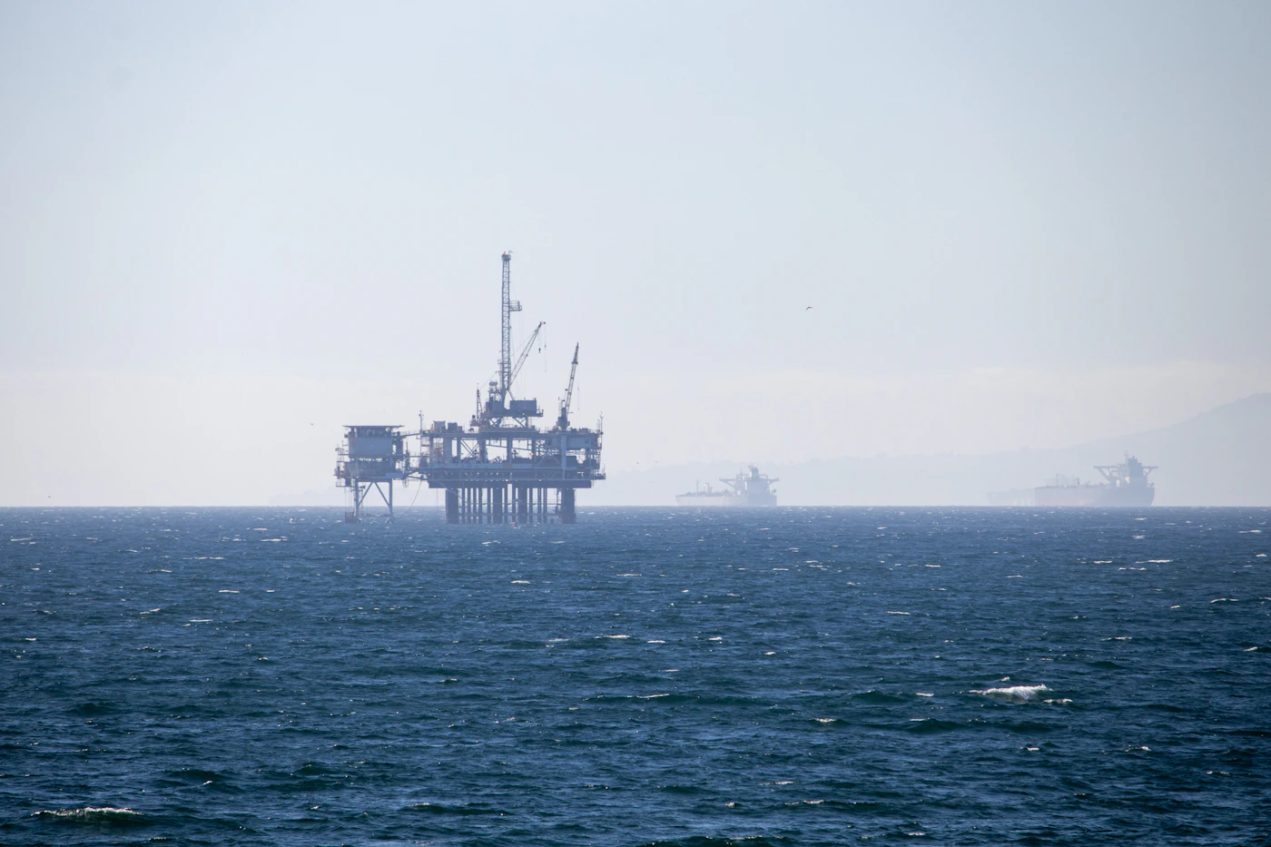 Offshore oil drilling platform in open water representing the offshore work environments covered by federal maritime law