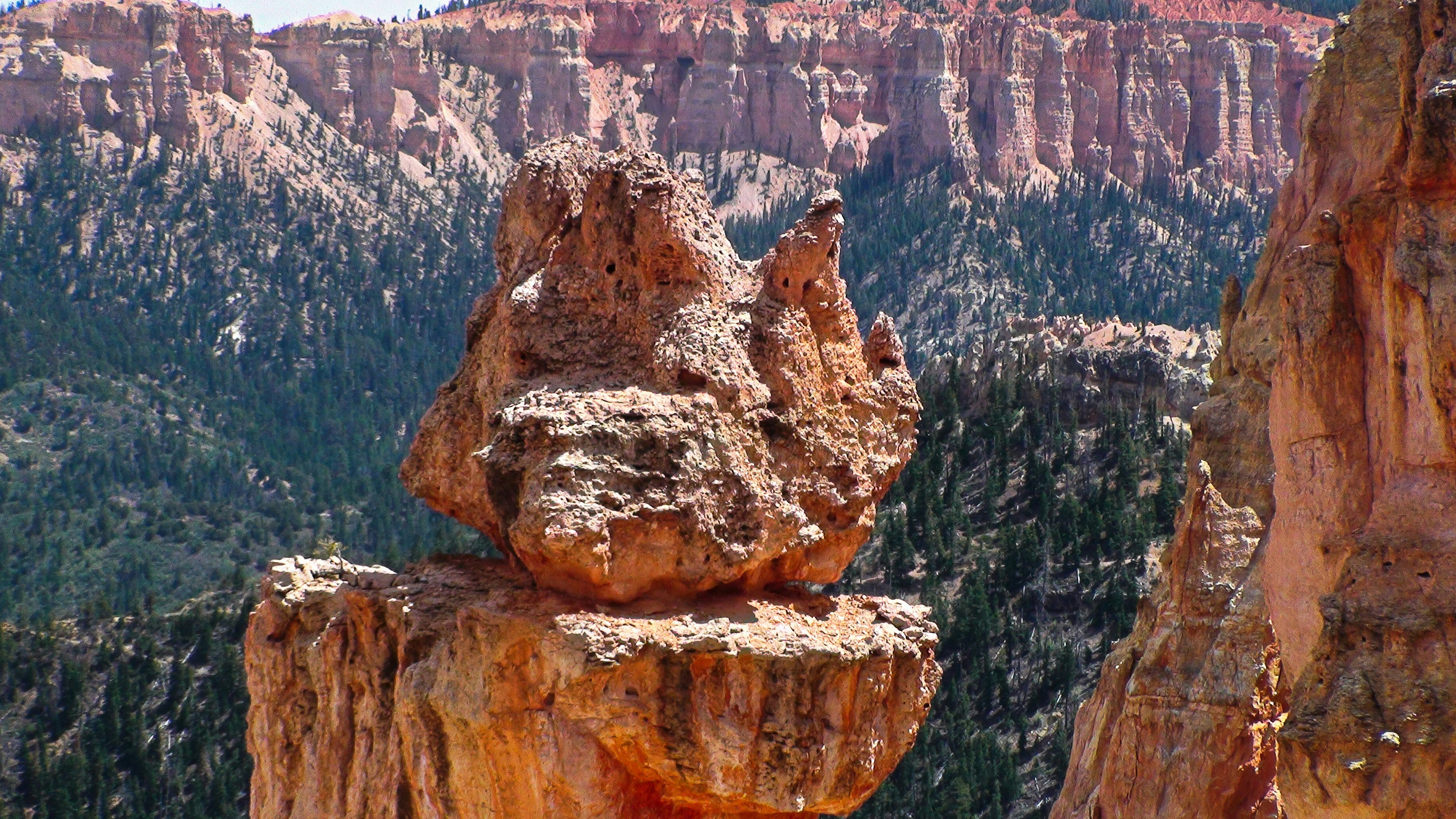 A rock formation in the middle of a mountain range