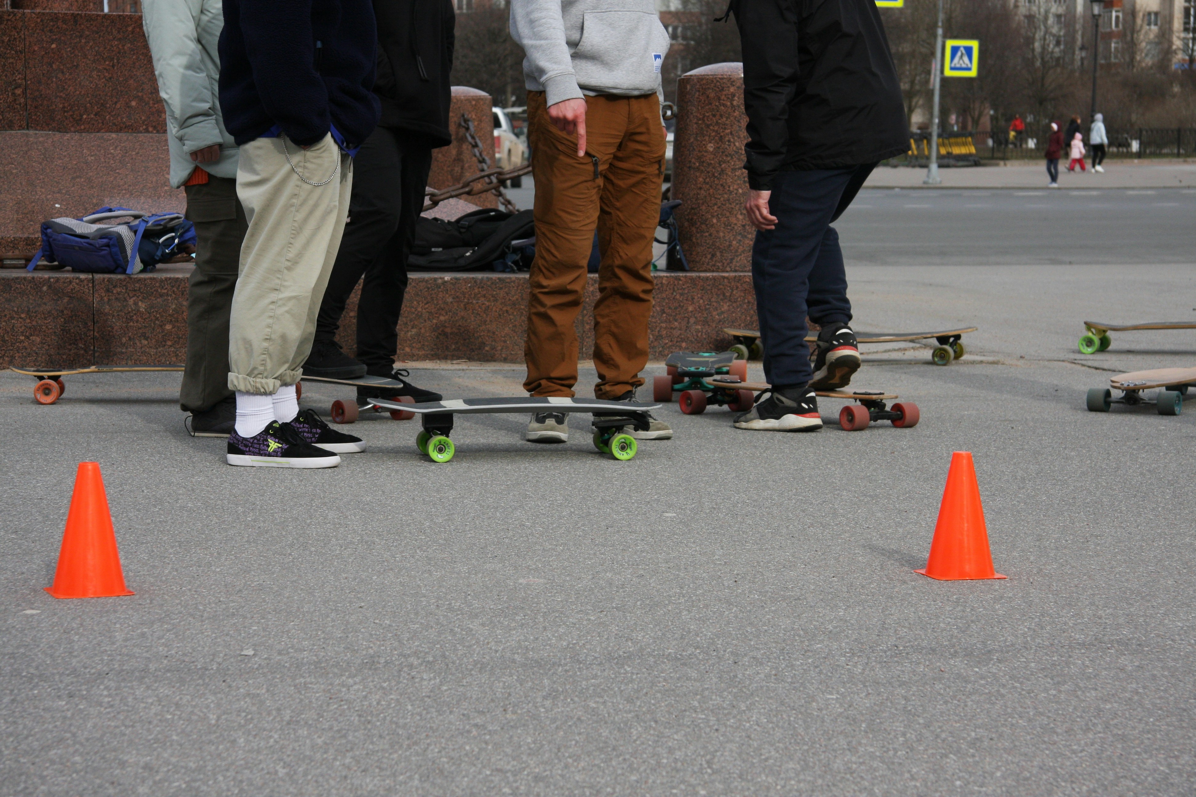 A group of young men standing next to each other on skateboards