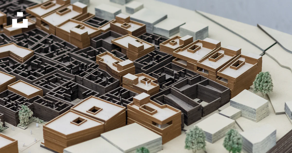 A model of a city is shown on a table photo – Free Maquette Image on ...