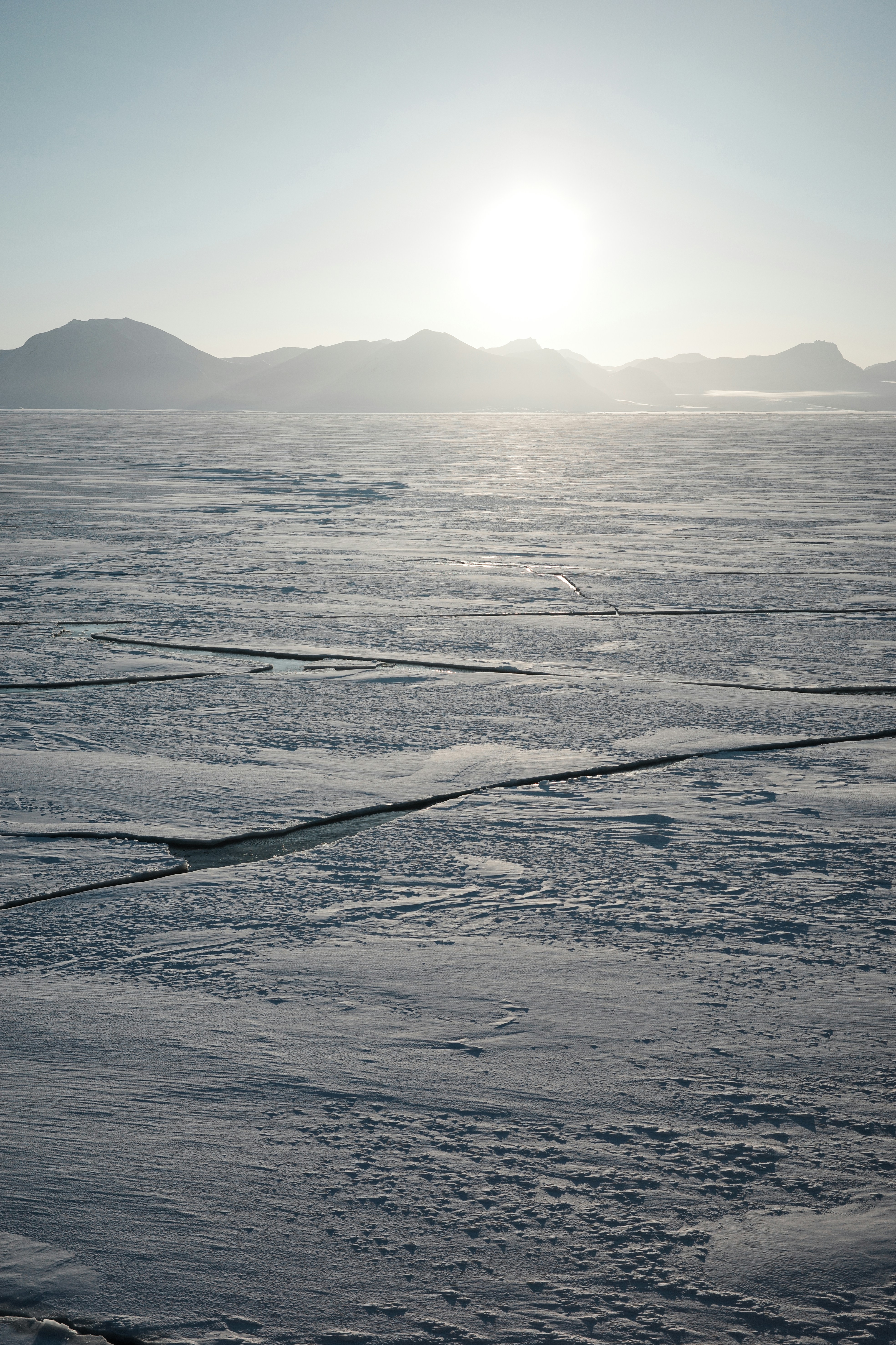 A person walking across a snow covered field