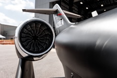 A close up of a jet engine on a runway