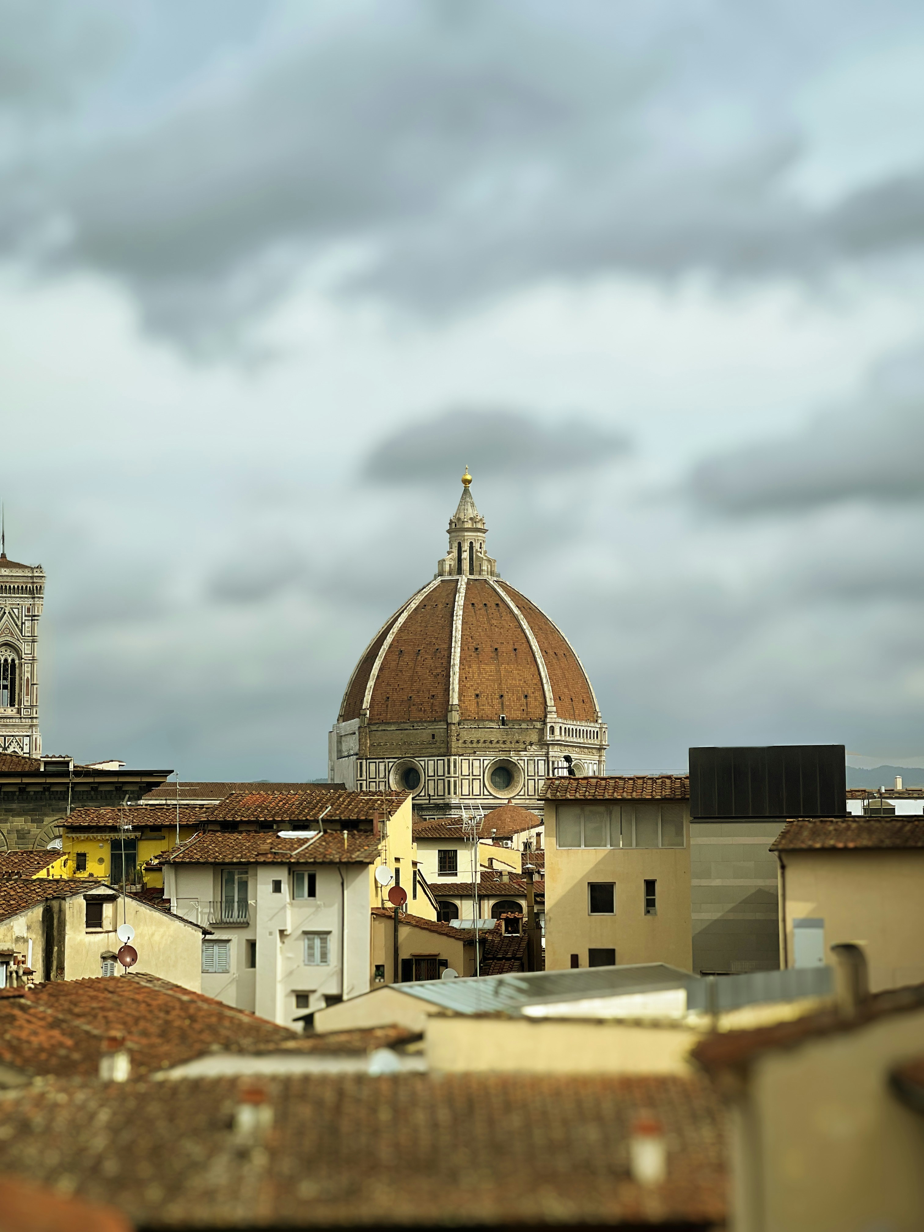 A view of a city with a dome in the background