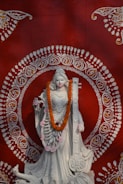 A statue of a woman in a white dress