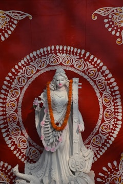 A statue of a woman in a white dress