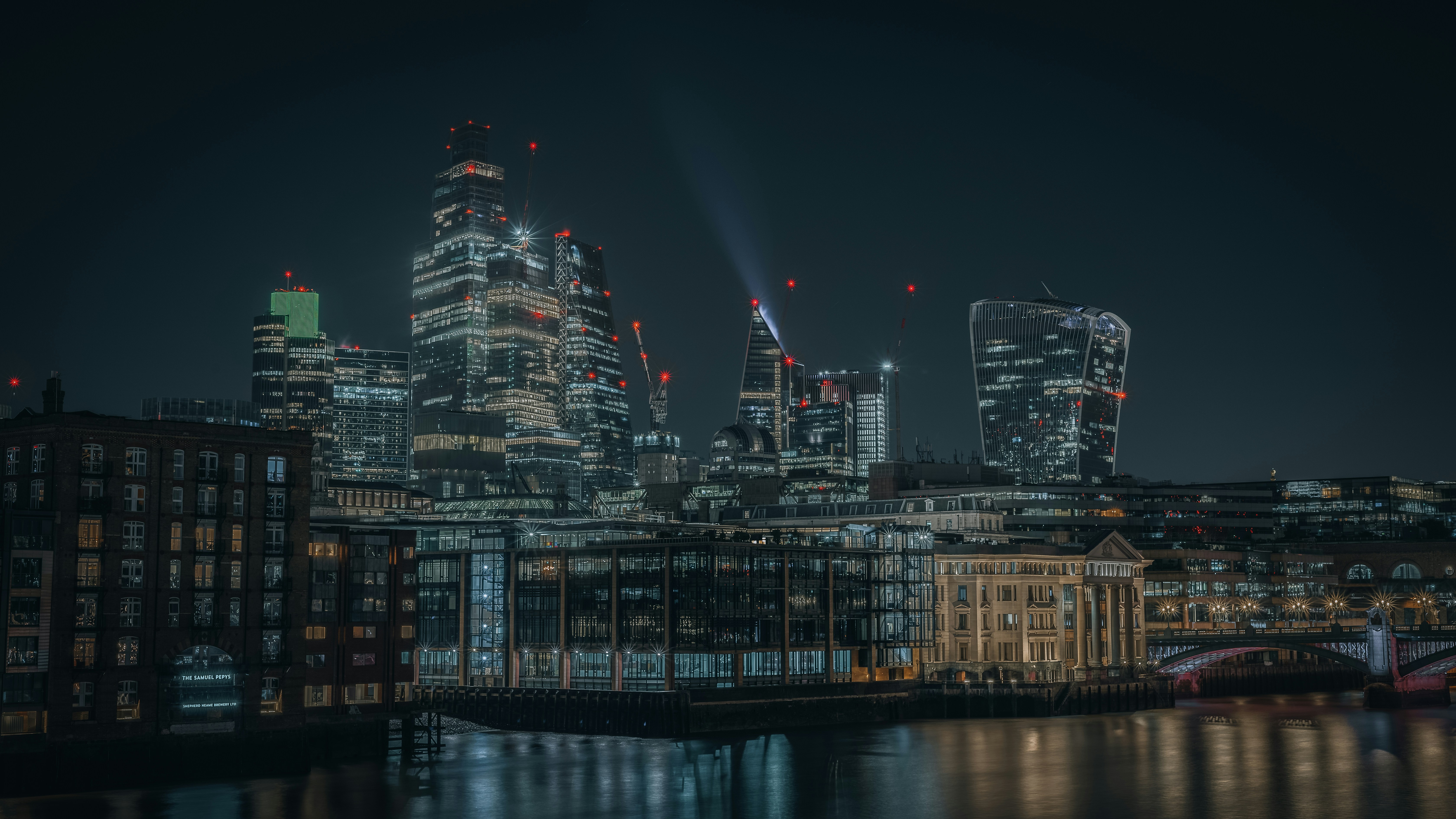 A night view of a city with a river running through it