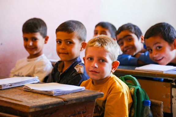 A group of children sitting at desks in a classroom