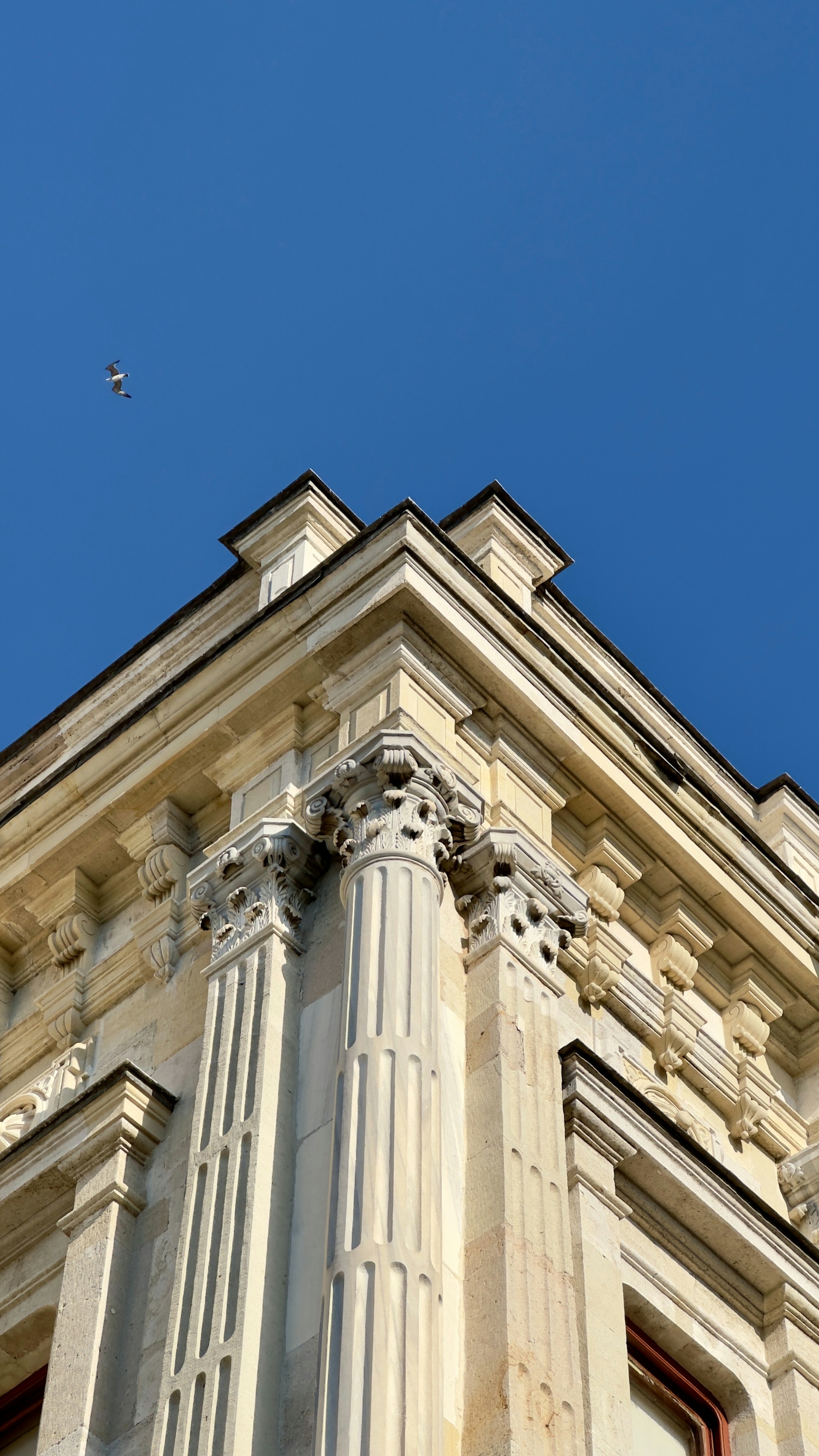 A very tall building with a clock on it's side