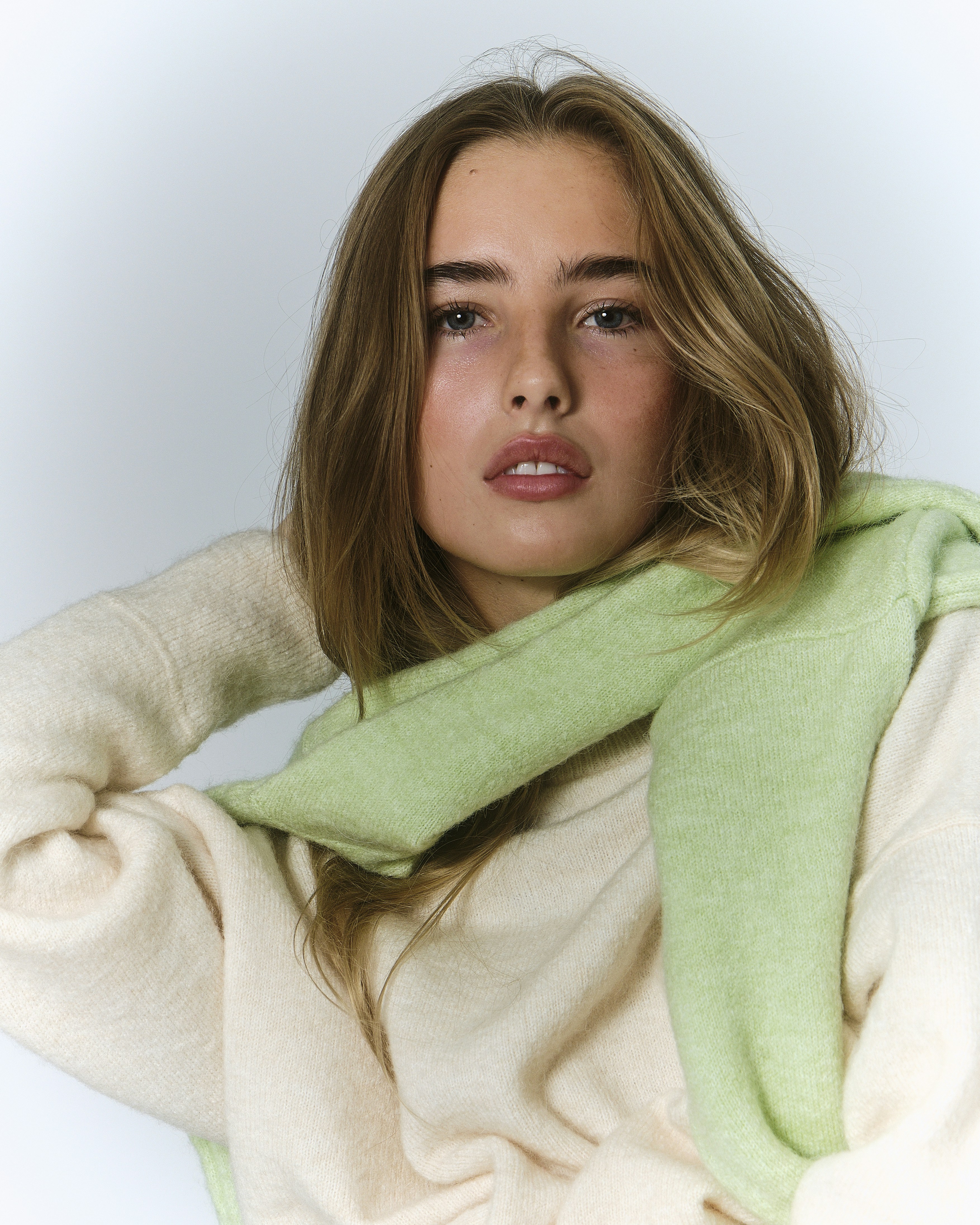 A woman with a green scarf around her neck photo – Free Human Image on ...