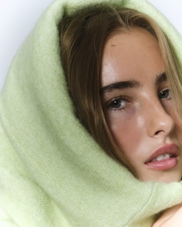 A woman with a towel wrapped around her head