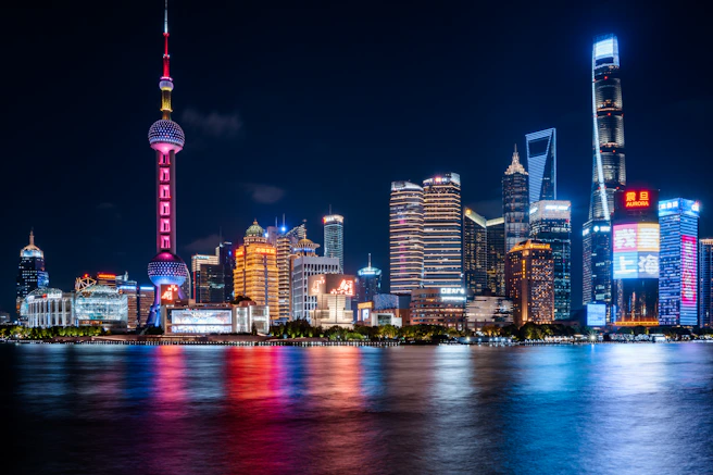 A view of a city at night from across the water