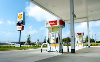 A gas station with a few gas pumps